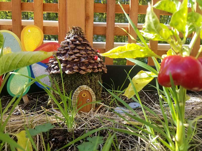 Close-up view of plants and decorative garden elements in the secret garden.